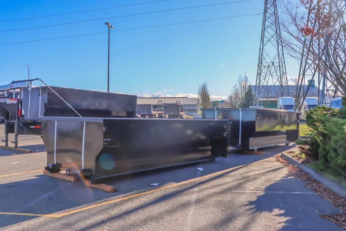 Roll-off dumpster ready for waste disposal at job site for 2 Yard Dumpster Rental in Spirit Lake